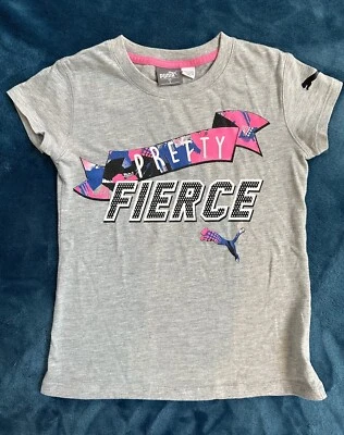 PUMA GIRLS TOP SHORT SLEEVE PRETTY FIERCE T SHIRT SIZE 5. - Image 1 of 3