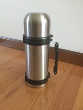 A stainless thermos, 32 oz, new with a handle, 11 x 4 inches.