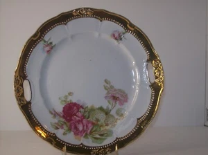 PORCELAIN HANDLED PLATE RIMMED IN GOLD AND A ROSE DESIGN - Picture 1 of 3