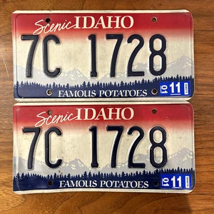 PAIR of Idaho License Plates - "7C 1728" 2011 sticker FAMOUS POTATOES SCENIC I - Picture 1 of 9