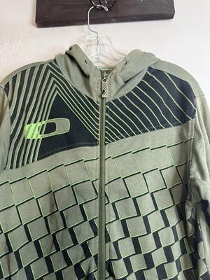 Chaqueta Oakley Verde Oliva Para Hombre Talla S Calce Ajustado Cremallera Y2K Geométrica Abstracta Foto 1 de 4