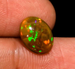 Natürlicher äthiopischer Opal Oval Multi Feuer Cabochon Lose Edelstein 10X8X4 mm 1,5 Kt - Bild 1 von 3