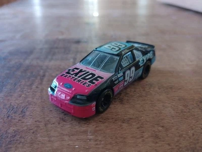 Racing Champions Jeff Burton #99 Exide Batteries Ford T-Bird Pink/Blue 1/64 - Image 1 of 4