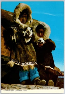 Postcard Ontario Moosonee ON Children of Canadian Arctic Inuit w Husky Puppies - Picture 1 of 2