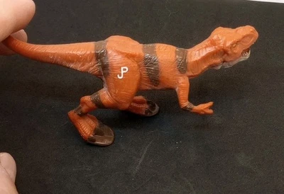 Figura de juguete de dinosaurio naranja Amblin Hasbro Jurassic Park Tyrannosaurus REX 2000 Foto 1 de 4