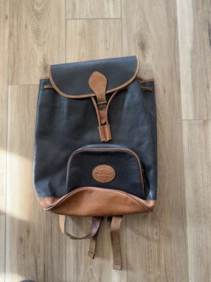 Mochila vintage EDDIE BAUER de cuero genuino con tapa ajustada negra y tostada Foto 1 de 4