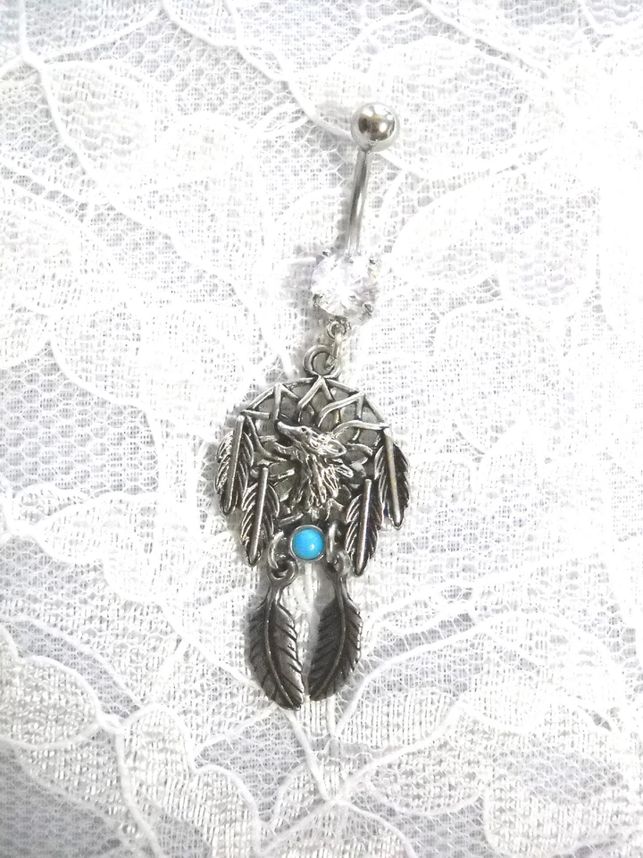 ANILLO OMBLIGO CABEZA DE LOBO ATRAPASUEÑOS CON 2 PLUMAS EXTRA 14g CZ TRANSPARENTE Foto 1 de 1