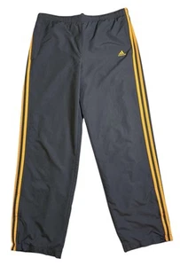 Pantalones de chándal Adidas unisex talla mediana 2009 Y2K azul oscuro con rayas doradas - Imagen 1 de 9