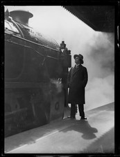 Czech violinist and composer Jan Kubelik standing next to a train a- Old Photo 1