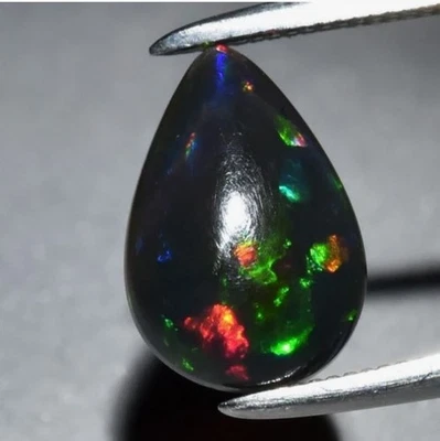 1.07ct 10x7mm Pear Cab Natural Floral Flash Play-Of-Color Crystal Black Opal Gem - Image 1 of 4