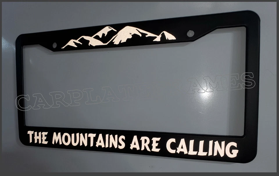 REFLECTIVE THE MOUNTAINS ARE CALLING  License Plate Frame - Image 1 of 1