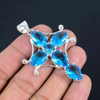 Colgante hecho a mano de plata de ley 925 con piedras preciosas de topacio azul suizo Foto 1 de 4