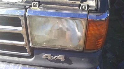 Driver Left Headlight With Chrome Trim Fits 87-91 BRONCO 31186701 Foto 1 de 4