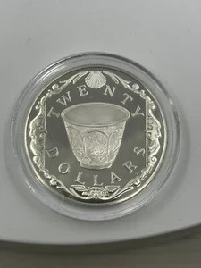 Moneda de plata 1985 $20 dólares Islas Vírgenes Británicas tesoro taza porcelana prueba - Imagen 1 de 2