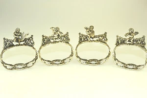 ANTIQUE 835 SILVER SET OF 4 FIGURAL NAPKIN RING 3D CHERUBS MUSICAL INSTRUMENTS - Picture 1 of 9