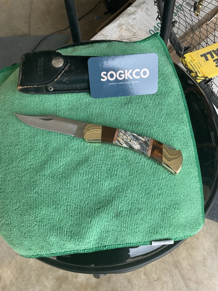 Cuchillo Buck Custom 110 mamut molar e incrustación de cobre y trabajo de archivo, funda Foto 1 de 4