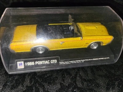 NEW RAY 1966 Pontiac GTO Diecast Car 1:43 Scale w/ Display Case  - Image 1 of 2