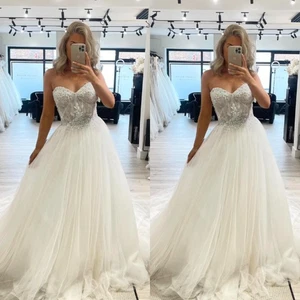 Strand Brautkleider Herzausschnitt Ärmellos A Linie Ivory Tüll Brautkleider - Bild 1 von 23