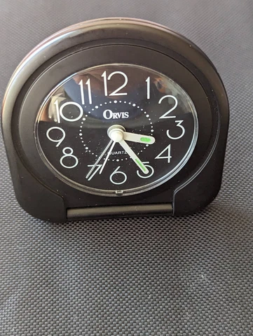 Orvis Black Quartz Travel Alarm Clock, folding, glow in dark hands, works Cover