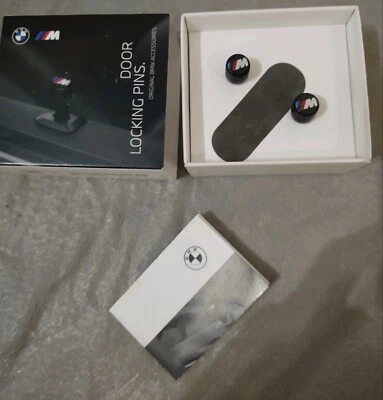 Par de pasadores de bloqueo de puerta BMW OEM M Performance se adapta a la mayoría de los modelos totalmente nuevos Foto 1 de 2
