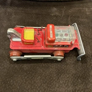 Bulldozer Nomura Toy Magic Action a pilas naranja juguete vintage - Imagen 1 de 6