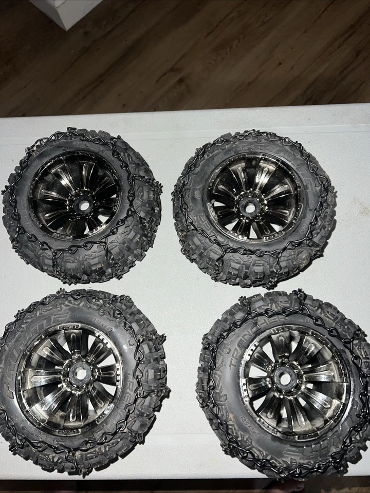 Proline Trencher 3.8" tires and rims. 17mm hex Black Chrome Rims W/ Chains RC - Image 1 of 4