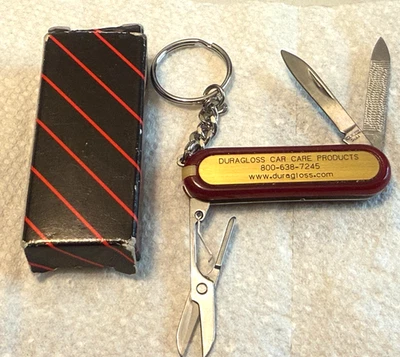 Cuchillo Publicitario DuraGloss Productos para el Cuidado del Automóvil con Llavero y 5 Herramientas Nuevo con Caja Foto 1 de 4