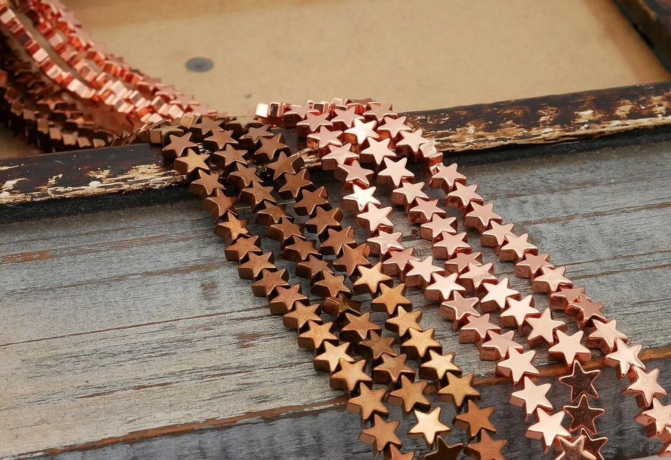 NELLYS  Strang Hämatit Perlen Sterne glänzend rosegold u. schoko ca. 6mm u 4mm - Bild 1 von 1