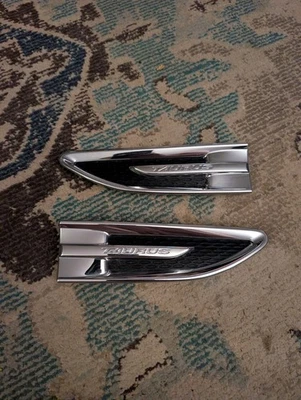 2010-2019 Ford Taurus Left Right RH LH Fender Chrome Emblem Trim Vent OEM Set - Image 1 of 4