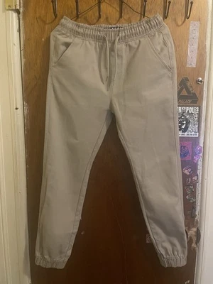 Pantalones de uniforme escolar caqui para niños talla 10-12 Foto 1 de 4