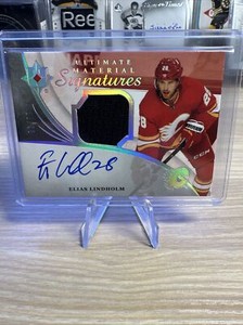 2020 Upper Deck Ultimate Collection Material Signatures /99 Elias Lindholm Auto