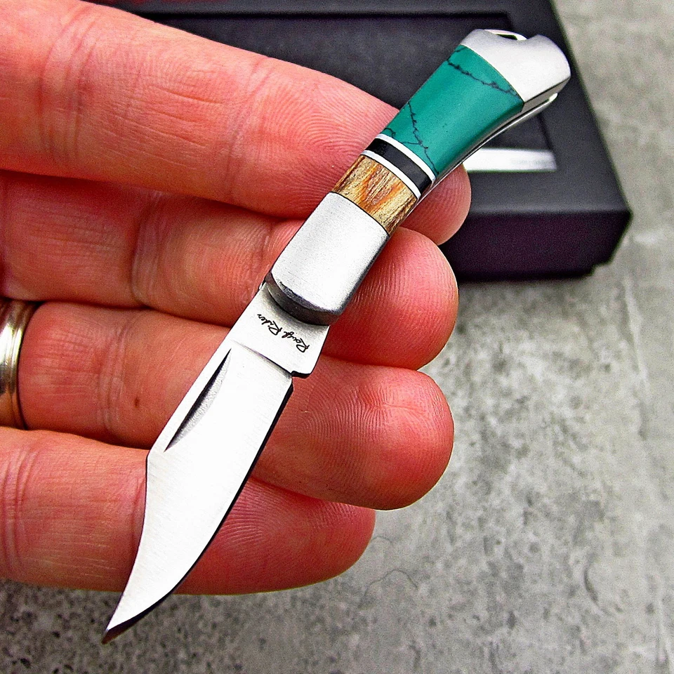 Rough Rider Turquoise & Brown Wood Handles Mini Folding Keychain Pocket Knife - Image 1 of 3