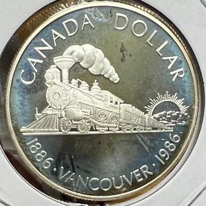 1986 CANADA SILVER DOLLAR BRILLIANT UNCIRCULATED COIN - Picture 1 of 2