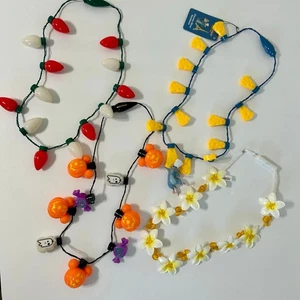 Disney Parks Menge 4 leuchtende Halsketten Neu mit Etikett Aulani Remy Halloween Weihnachten - Bild 1 von 11