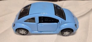 Volkswagen New Beetle New Ray 1999 1:32 Speedy Power Blue Pull Back VW Diecast - Picture 1 of 4