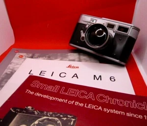 Leica Sammlung. Tolle Geschenkidee inkl. Blechkamera Bonboniere! - Bild 1 von 11