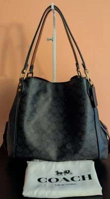 Bolso de hombro Coach Edie 31 Signature de lona y cuero azul marino medianoche Foto 1 de 4