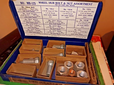 MB125 CHAMP ITEMS WHEEL HUB BOLT & NUT ASSORTMENT DISPLAY CABINET METAL VINTAGE  - Image 1 of 4