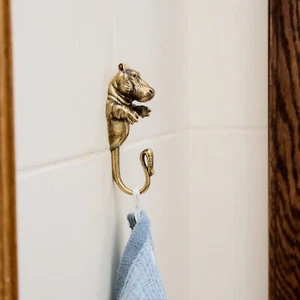 A wall hook for clothes is made of brass in the form of a hippopotamus. - Picture 1 of 10