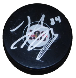 LANDON SLAGGERT signed (CHICAGO BLACKHAWKS) Centennial 100 puck BECKETT BU41232 - Picture 1 of 2
