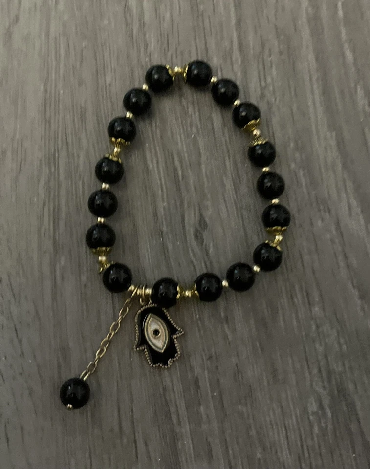 Ojo 🧿🪬 Pulsera Negro Elastizada Tono Dorado 👌👌 Foto 1 de 1