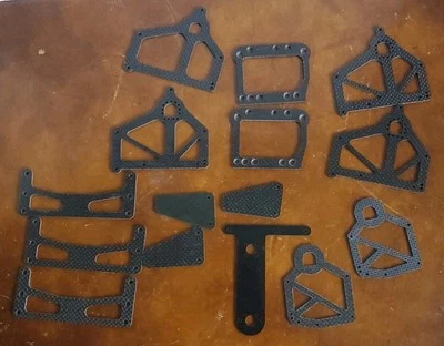 Vintage Team Associated Rc12L LOT of 15 Misc Carbon Fiber Chassis Parts - Image 1 of 4