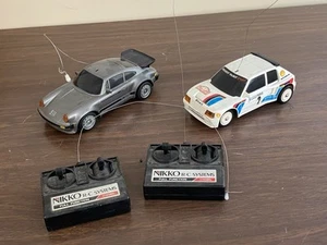 Lot de 2 voitures Nikko Peugeot 205 T16 + Porsche 911 - Imagen 1 de 11