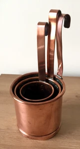 A SET OF THREE STURDY CIRCULAR-SHAPED COPPER MEASURERS c/w LONG HOOKED HANDLES - Picture 1 of 6