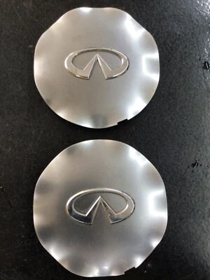 Tapacubos centrales plateados Infiniti M35 M45 OEM 40315CG210 2006-2007 Foto 1 de 4