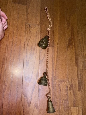 VTG Bells Of Sarna India- Floral Etched Brass Tone Graduated Set Of 3 On A Rope - Image 1 of 4