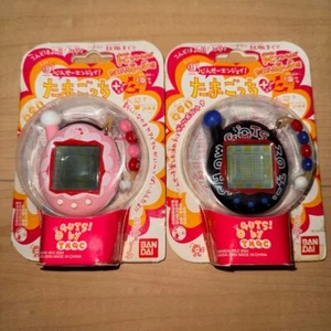 Bandai Jinsei Enjoy Tamagotchi Plus Guts Negro Volantes Rosa Set de 2 - Imagen 1 de 2
