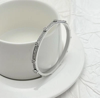 2026 Tory Rinestone Silver Bangle with Jewelry Pouch Width 5.7cm , hight 5cm - Image 1 of 3