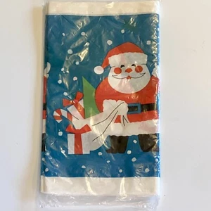 NIP VINTAGE CHRISTMAS SANTA CLAUS PAPER TABLECLOTH 54''×88" MADE IN USA - Picture 1 of 4