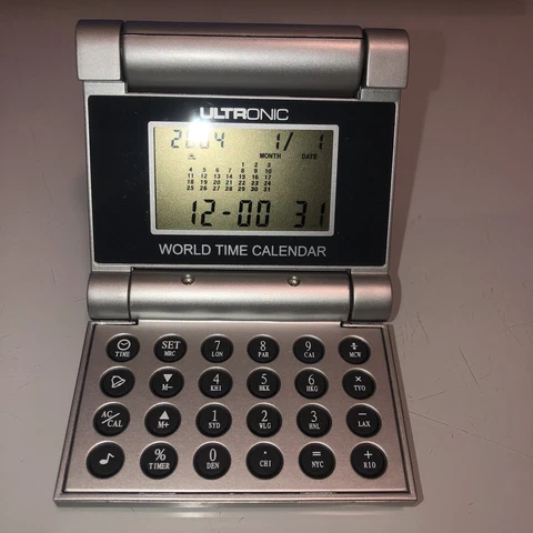 Ultronic World Time Calendar Travel Alarm Clock - folds Flat Cover